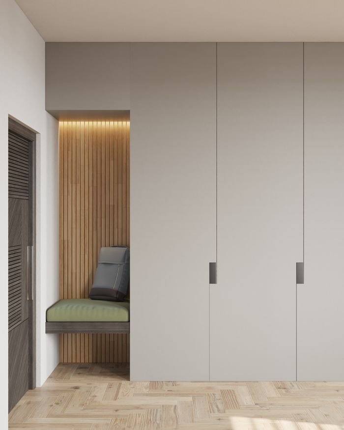 about-us-02 Elegant minimalist room featuring built-in seating and white cabinets.